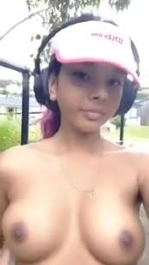 Thai girl shows her boobs on park